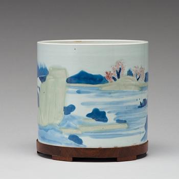 An underglaze blue, copper-red and celadon-glazed brushpot, Qing dynasty, early 18th Century, with Chenghuas mark.