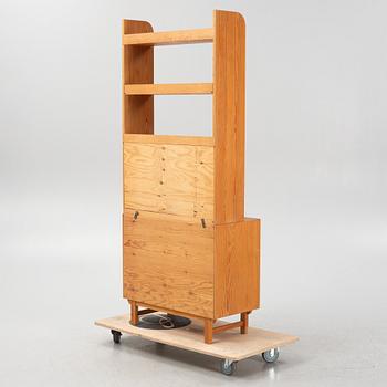 Göran Malmvall, a pinewood book case with secretaire and cabinet, second part of the 20th Century.