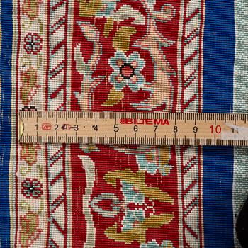 A rug, silk Hereke, ca 143 x 63,5 cm.