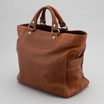 Céline, a leather handbag.