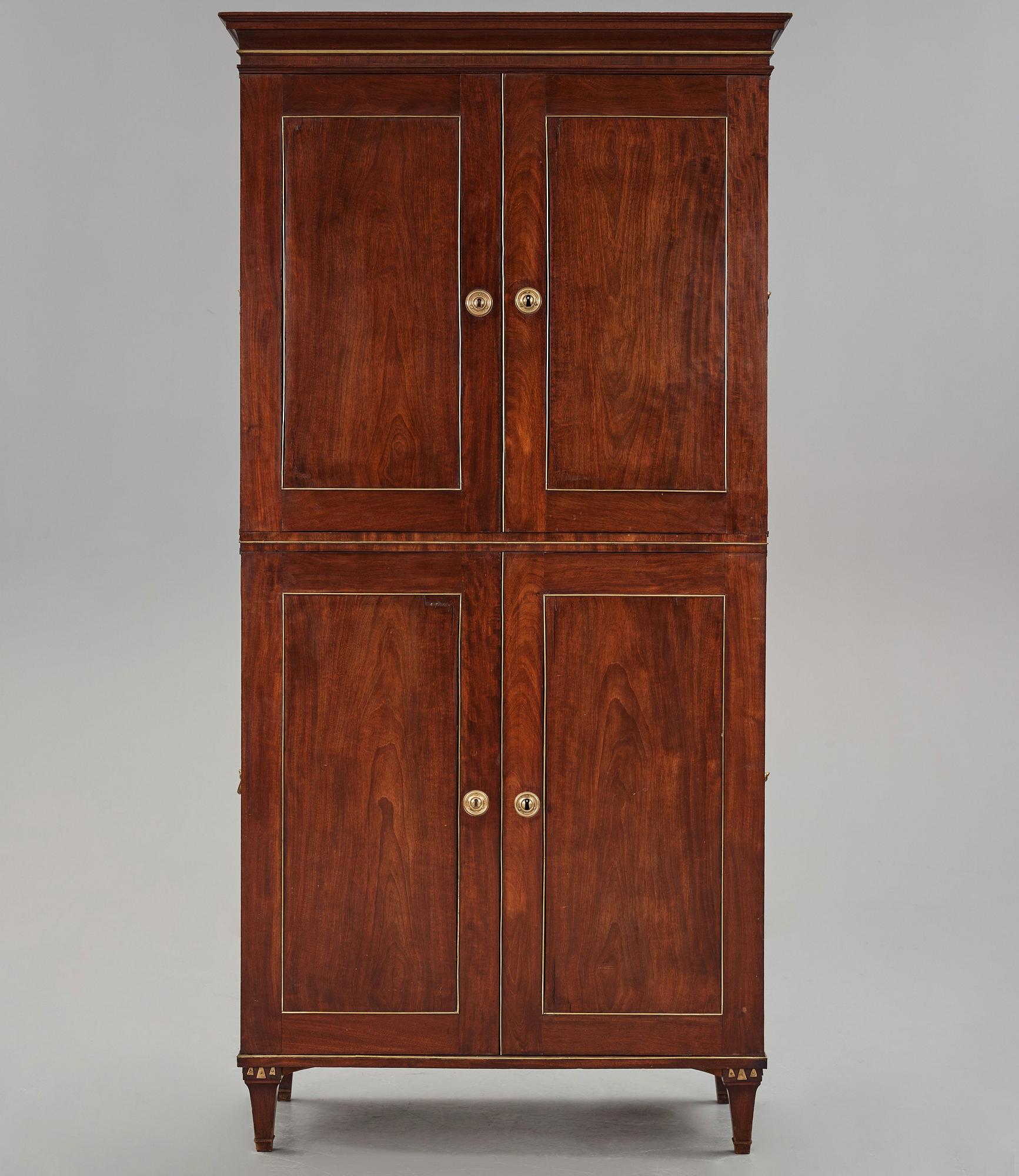 A late Gustavian mahogny cupboard.