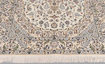 A Nain part silk carpet, 254 x 156 cm.