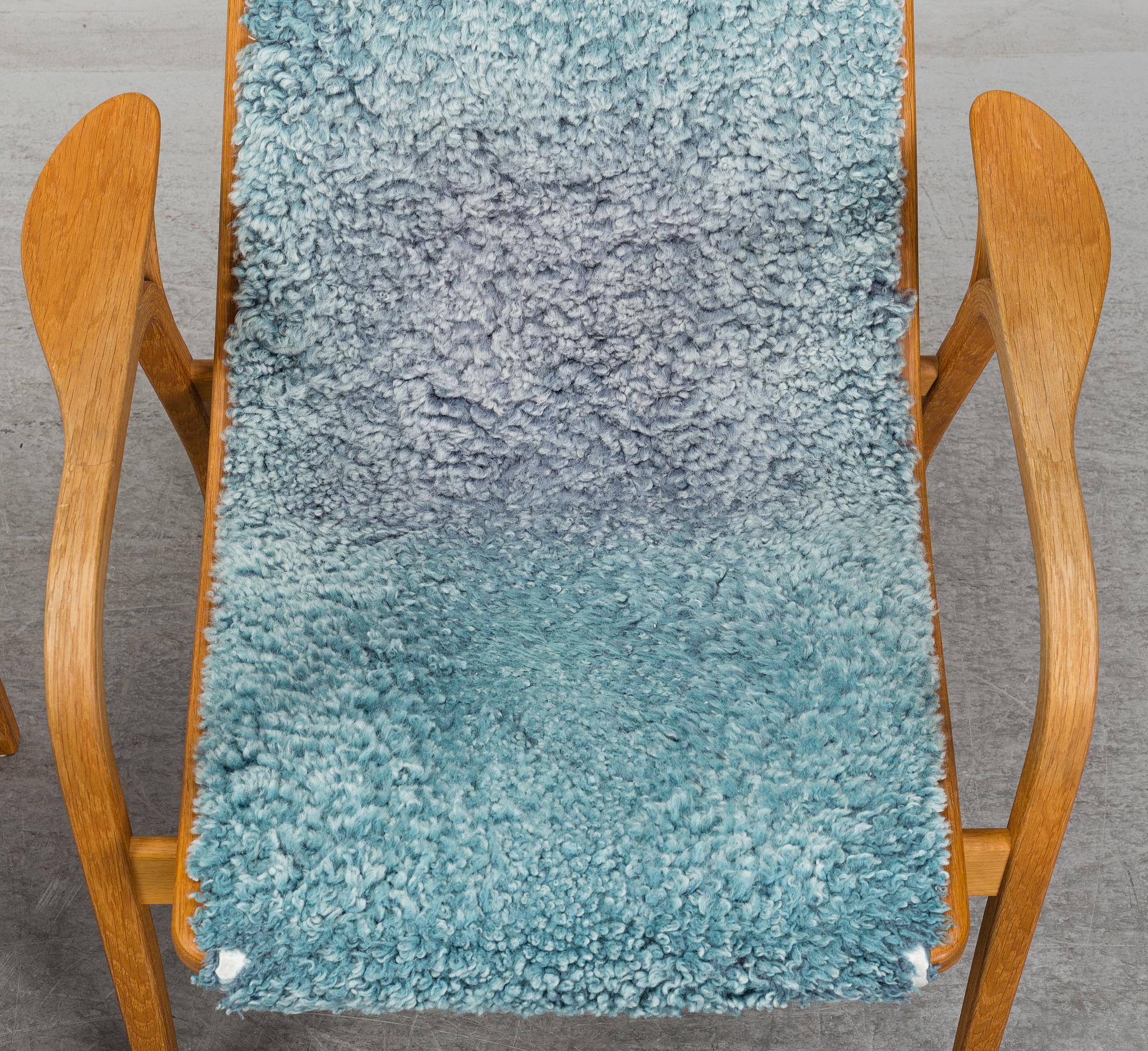 YNGVE EKSTRÖM, a 'Lamino' armchair with a stool, Swedese.