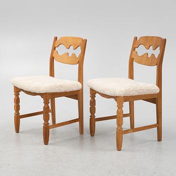 Henning Kjærnulf, a set of six oak 'razorblade' chairs, with new sheepskin upholstery, for EGK, 1960s.