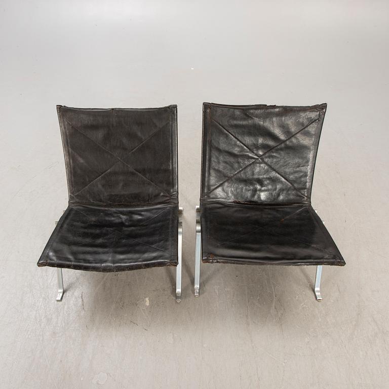 A pair of Poul Kjaerholm metal and leather PK22 easy chairs from Kold Christensen Denmark.