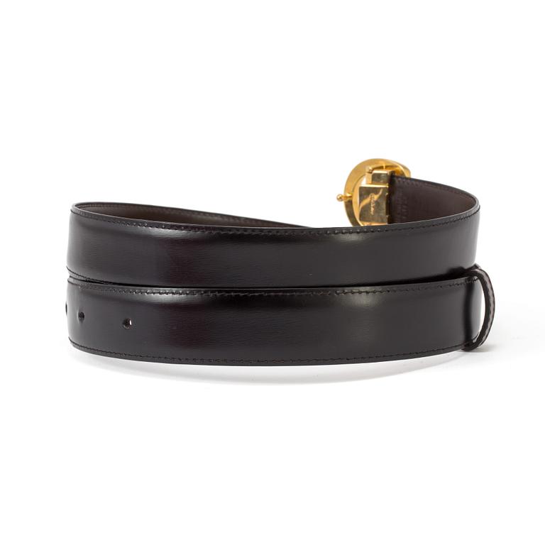 A black leather belt by Cartier.