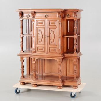 A cabinet in baroque style, made in the first half of the 20th century.