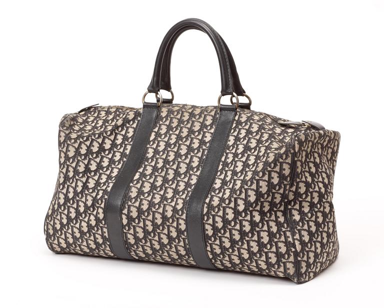 A monogram canvas bag by Christian Dior.