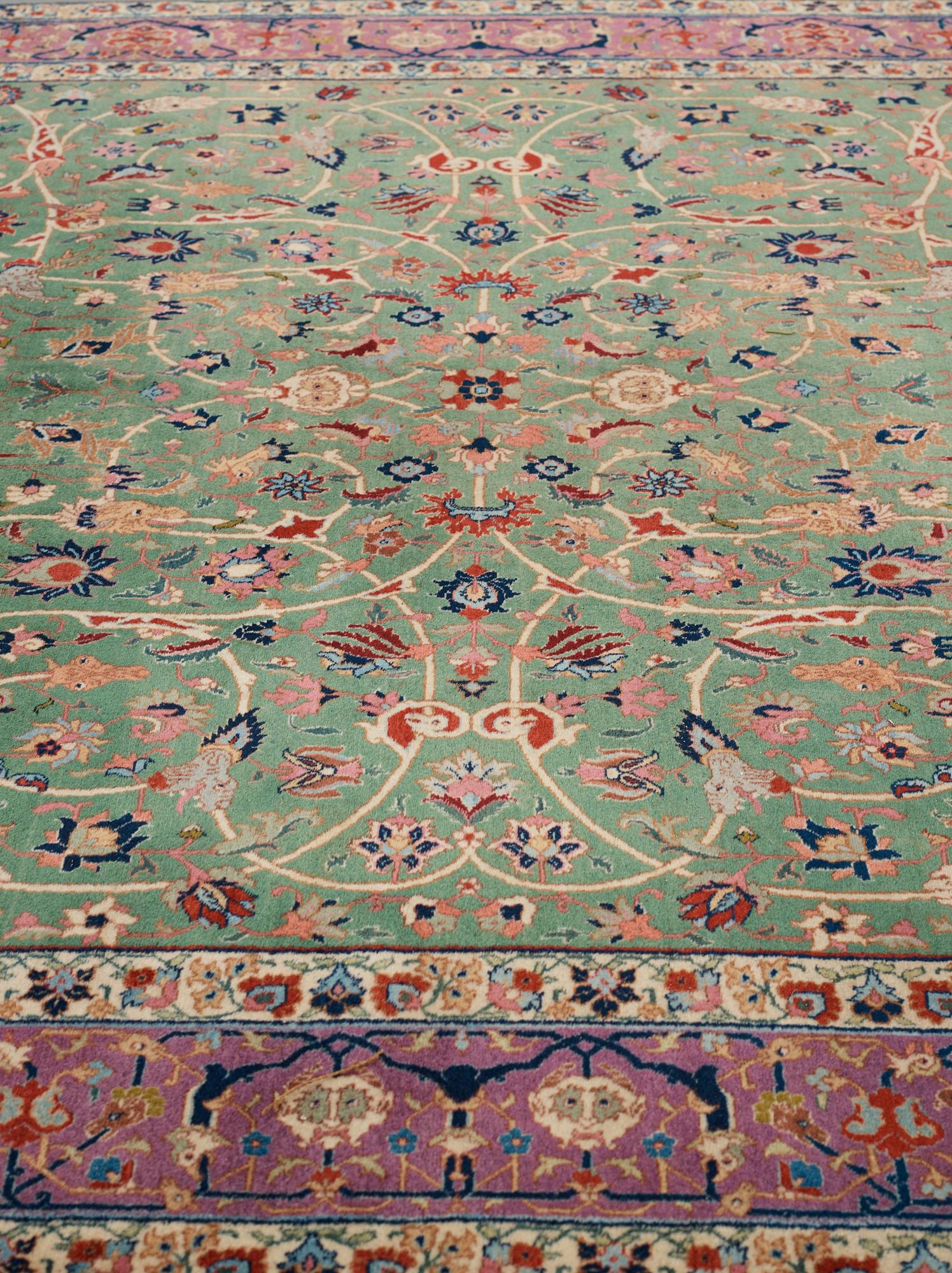 A carpet, a semi-antique Tabriz, ca 374-376,5 x 268-276 cm.