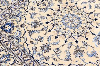 A rug, Nain part silk, ca 197 x 197 cm.