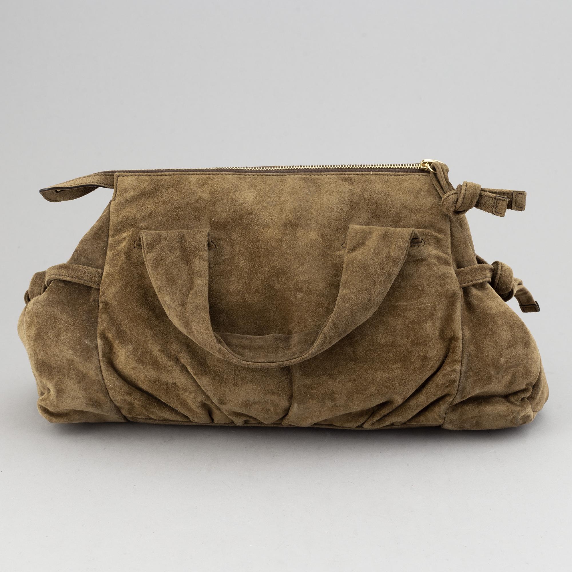 Gucci, a suede bag.