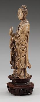 A stone sculpture of Guanyin, Qing dynasty (1644-1912).