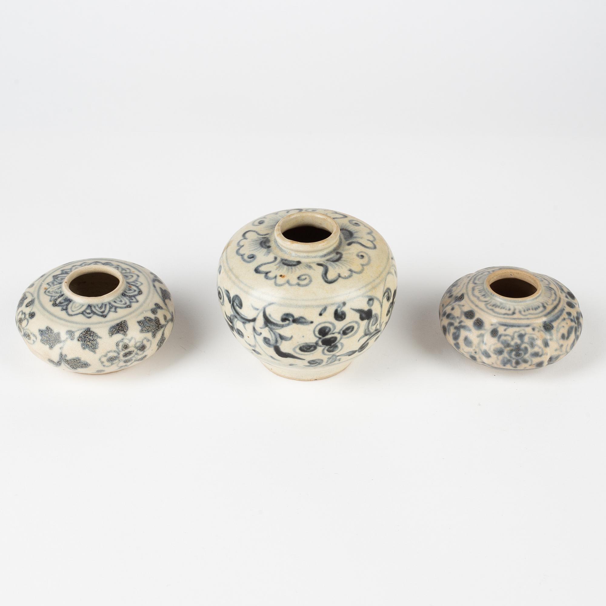 Two blue and white brush washers and a miniature pot, South East Asia, 15th/16th Century.