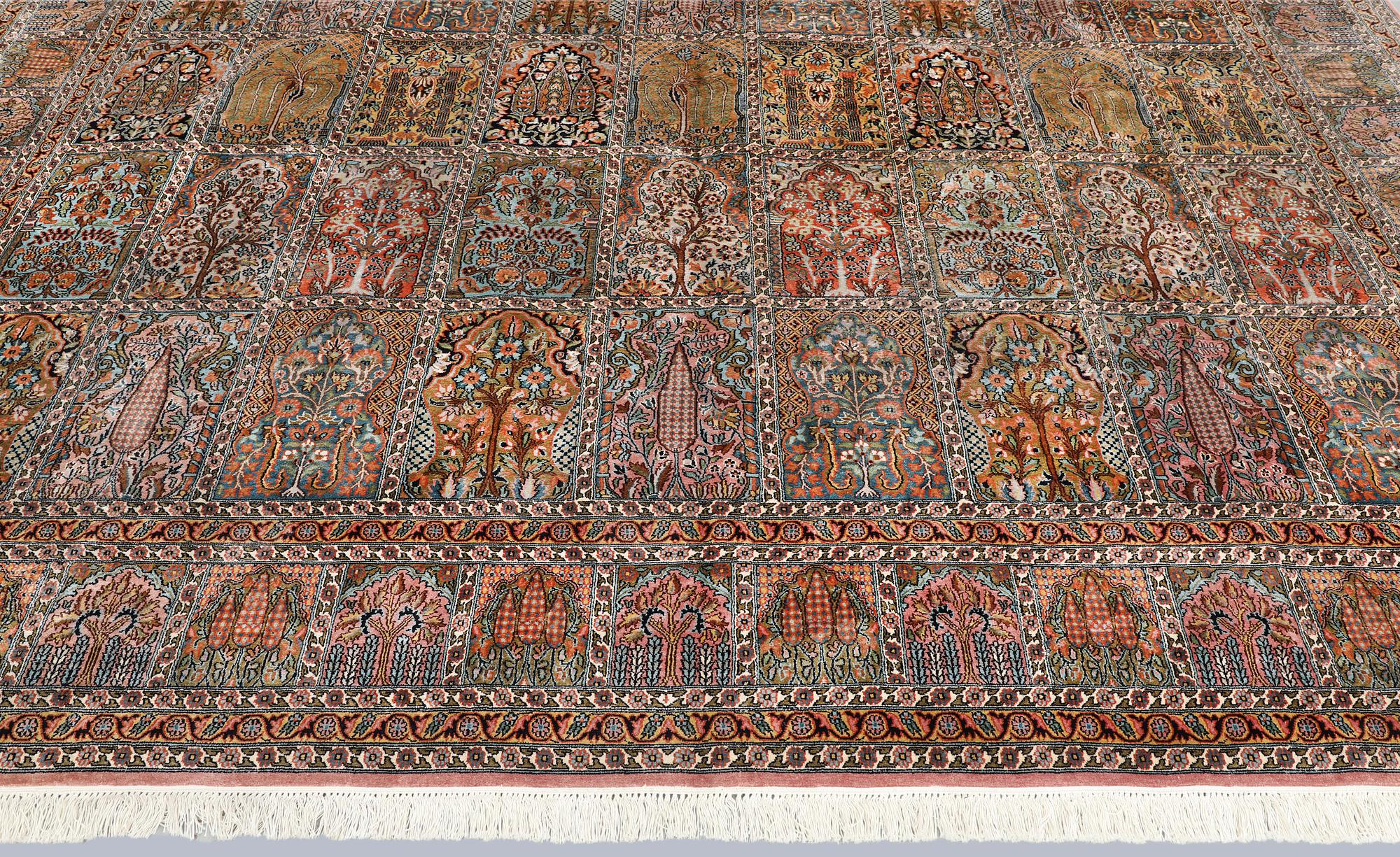 A Kashmir silk carpet, 418 x 297 cm.