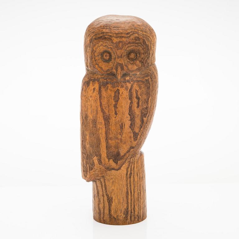 Gunnar Uotila, a wooden sculpture signed -56-.