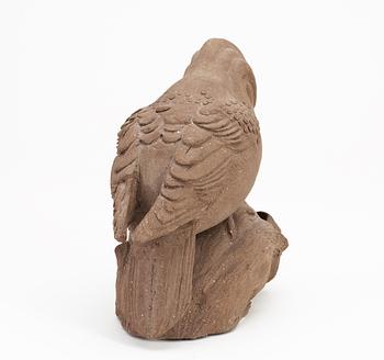 A Tyra Lundgren stoneware wood-pecker, signed with a seal.