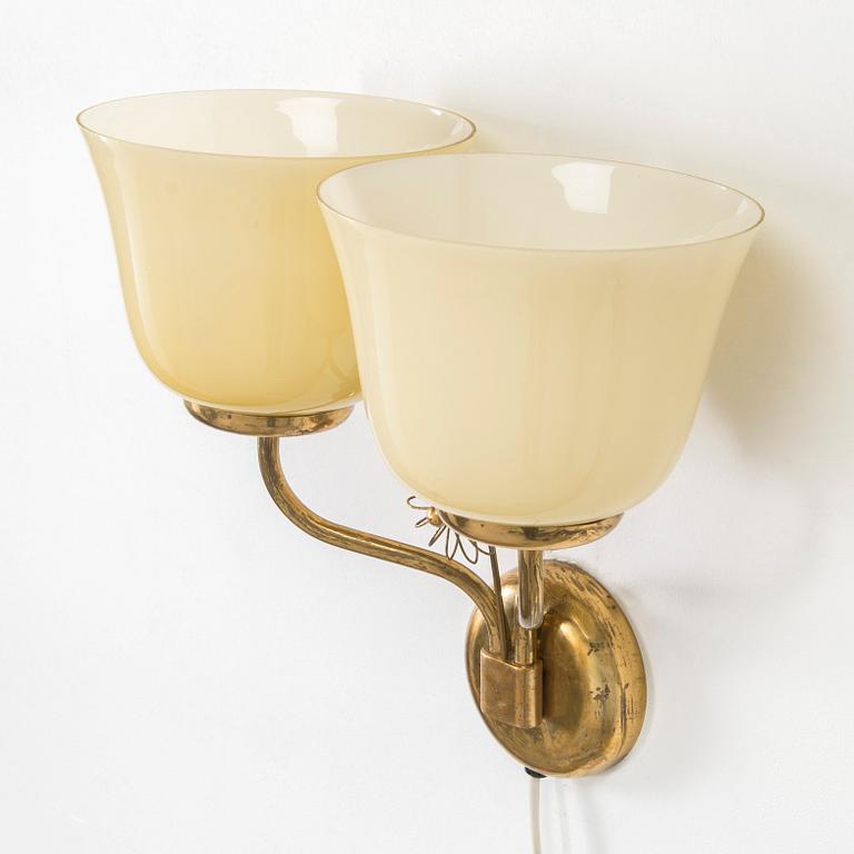 A mid-20th century wall light for Korumo.