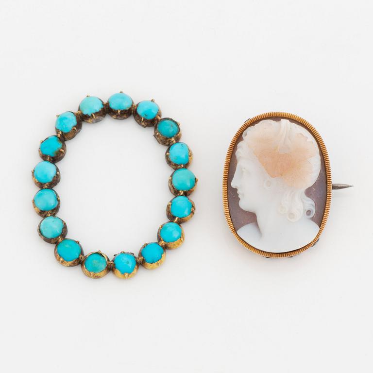 A hardstone cameo brooch with a detachable turquoise frame.