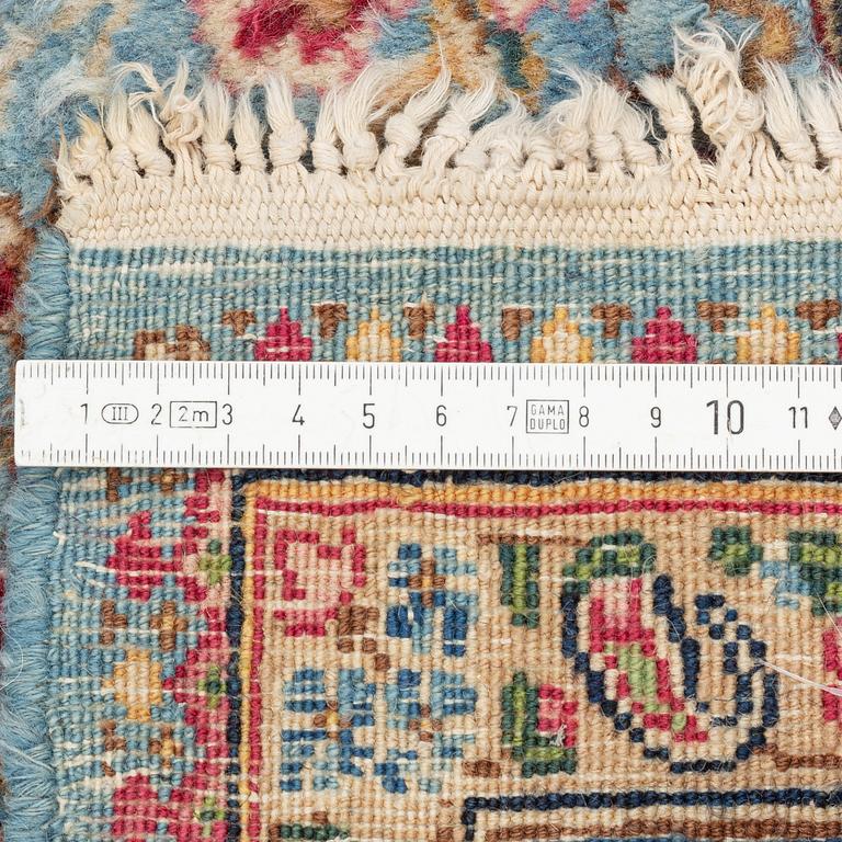 A Persian rug, c. 220 x 140 cm.