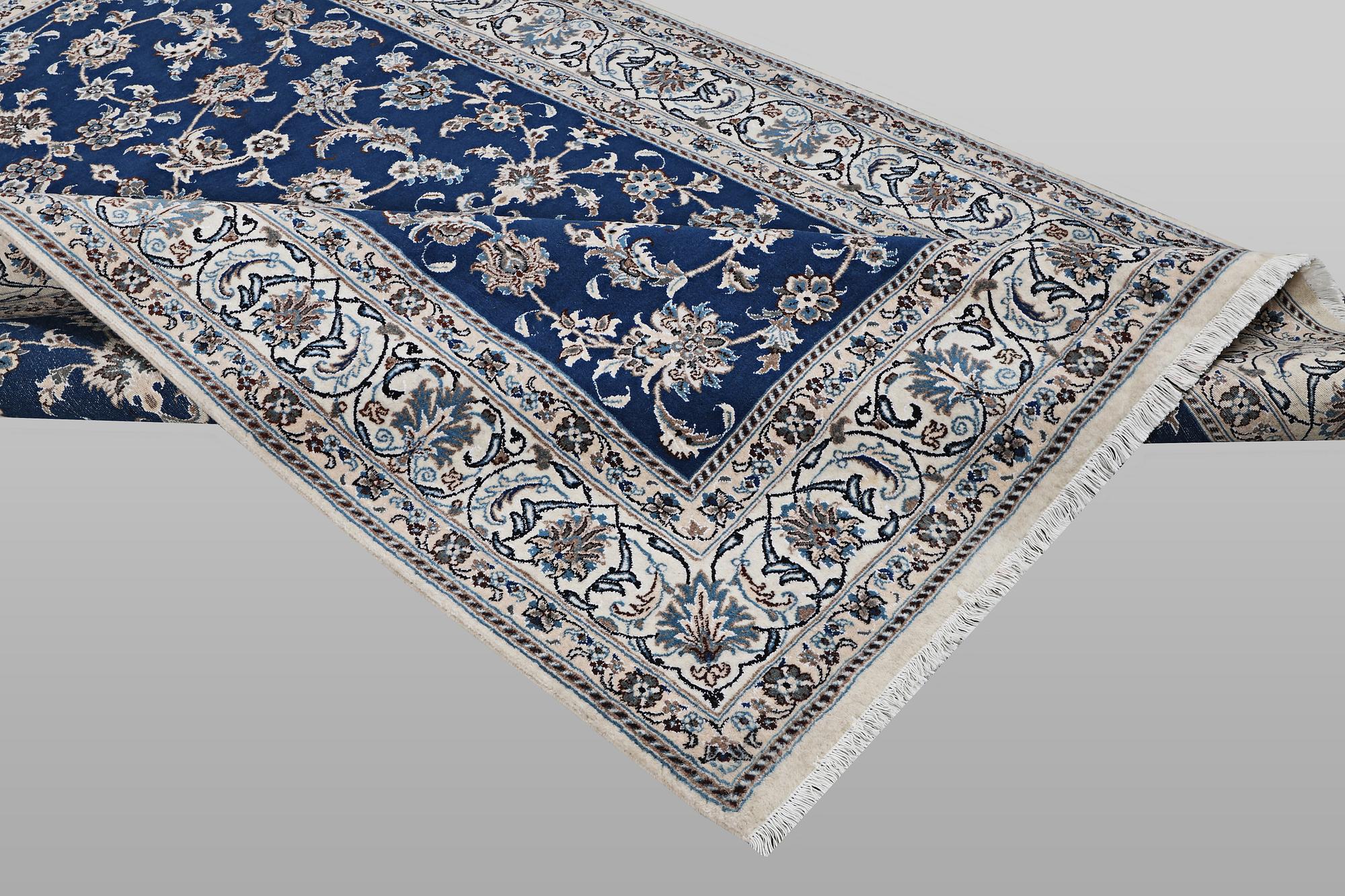 A carpet, Nain, part silk, ca 297 x 194 cm.