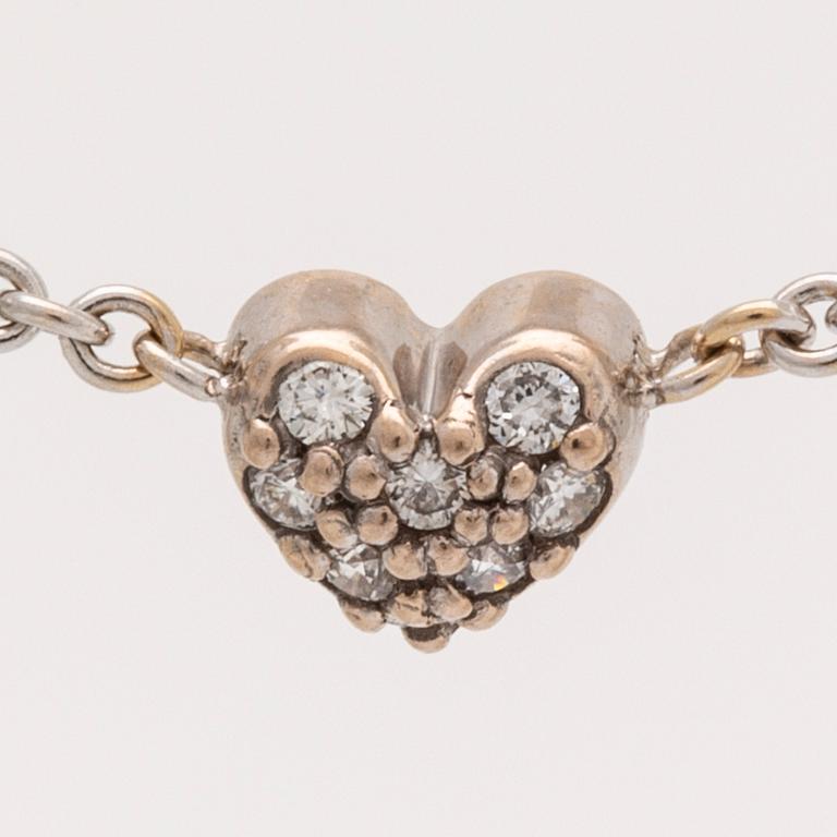 Lynggaard pendant on cjain, 18k whitegold brilliant-cut diamonds 0,08 ct, width heart approx 5 mm, length 40 cm, dustbag.