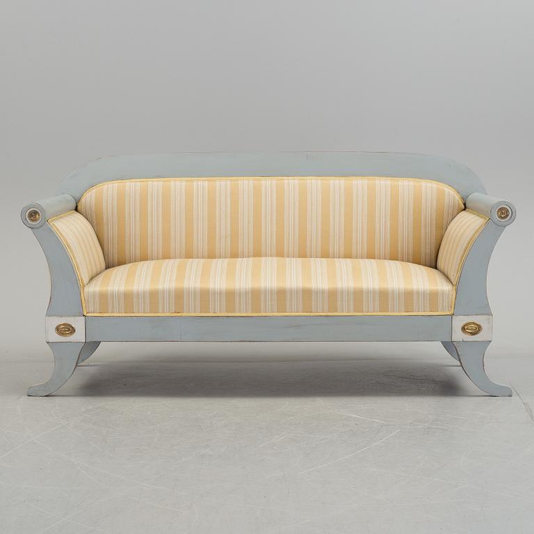 A mid 19th century painted sofa.