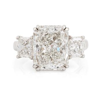 A platinum ring set with a radiant-cut diamond 6.21 ct H vs2, by KWIAT.
