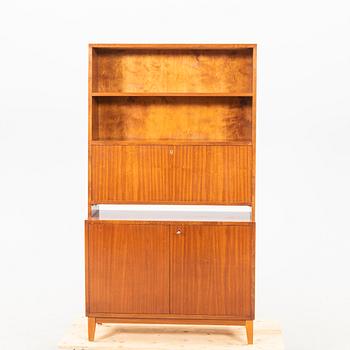 A 1940s mahogany book shelf with writing desk.