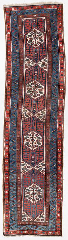 An antique Kurdish runner, probably,. 406 x 105 cm.