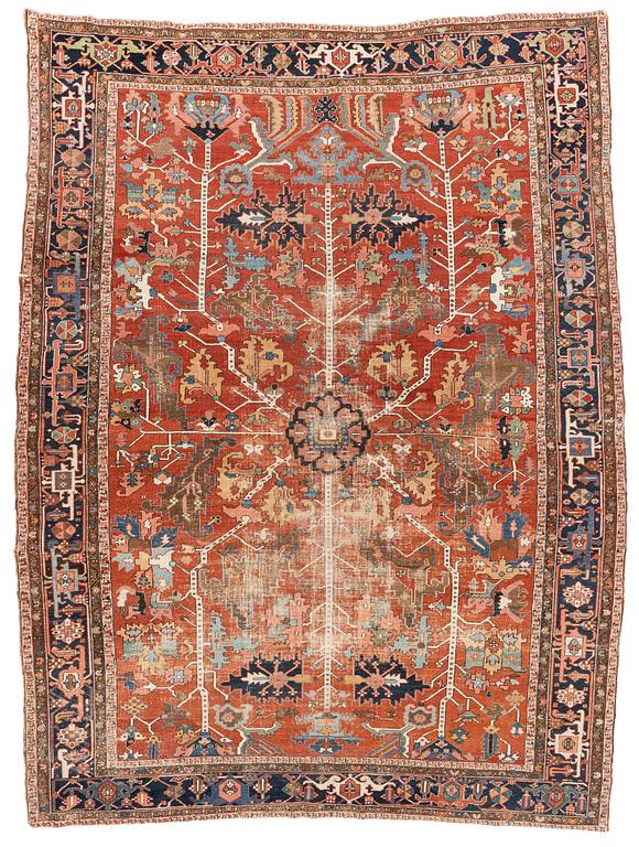 A antique Heriz carpet, ca 384 x 275 - 290 cm.