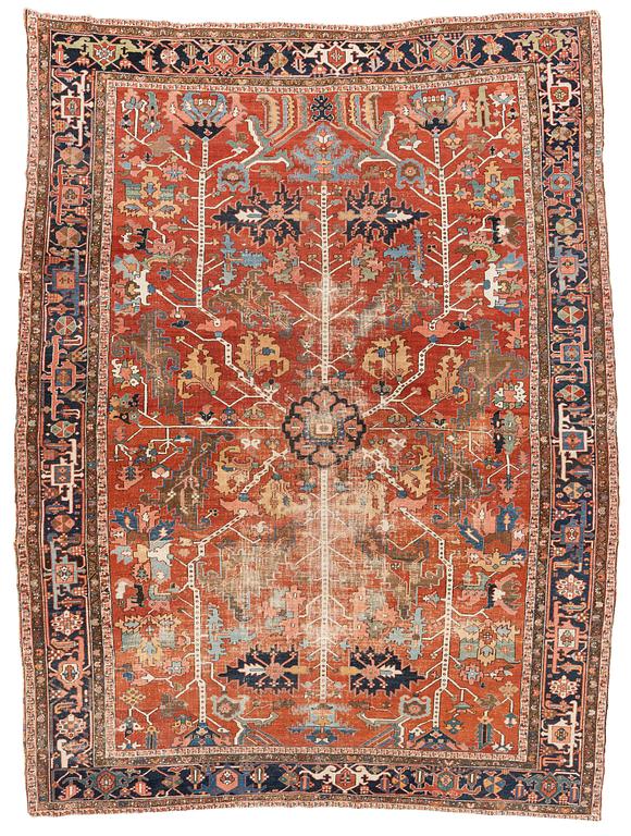 A antique Heriz carpet, ca 384 x 275 - 290 cm.