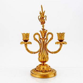 A pair of Louis XV-style bronze candelabras.