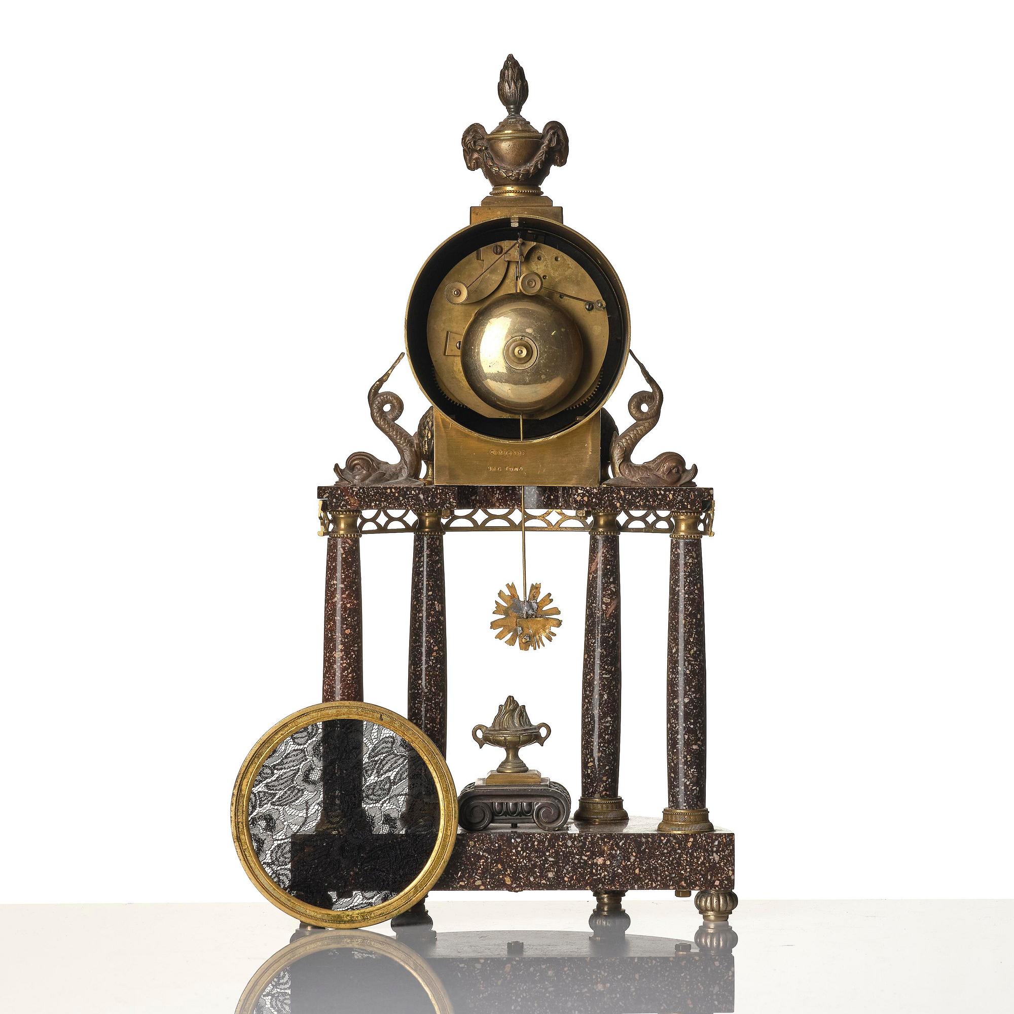 A late Gustavian-style porphyry portico clock.