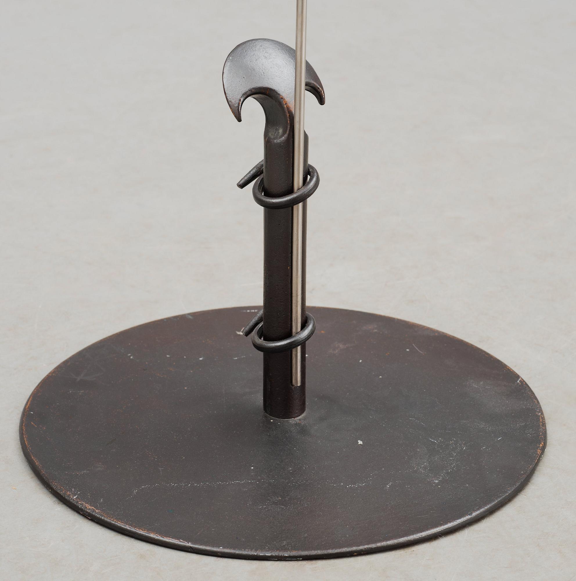 A Tore Ahlsén patinated bronze and white metal floor lamp, probably for Nordiska Kompaniet, 1940's.