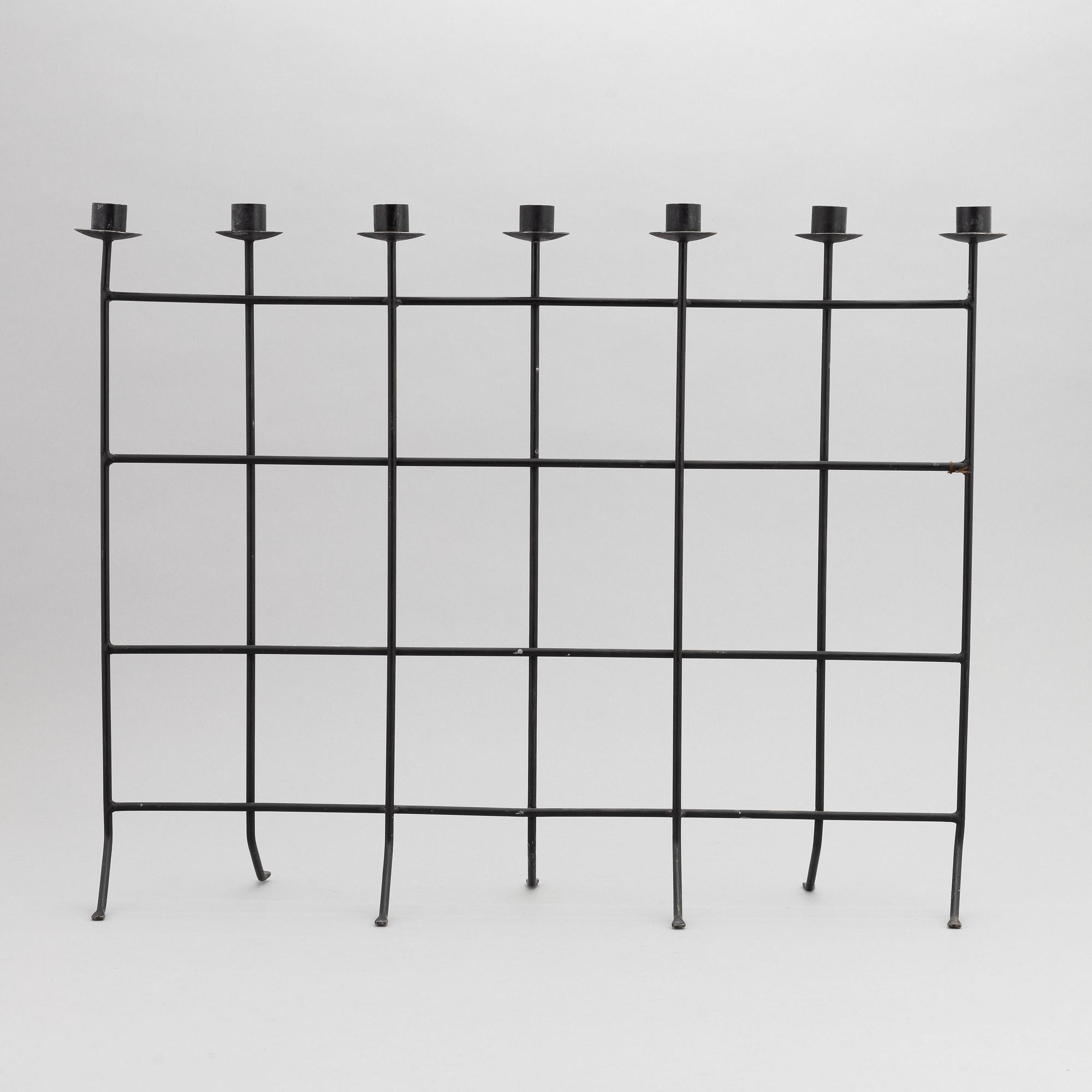 An iron candlestick, second half of the 20th Century.