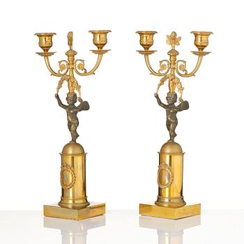 A pair of Empire gilt-brass two-branch candelabra, Stockholm, early 19th century.