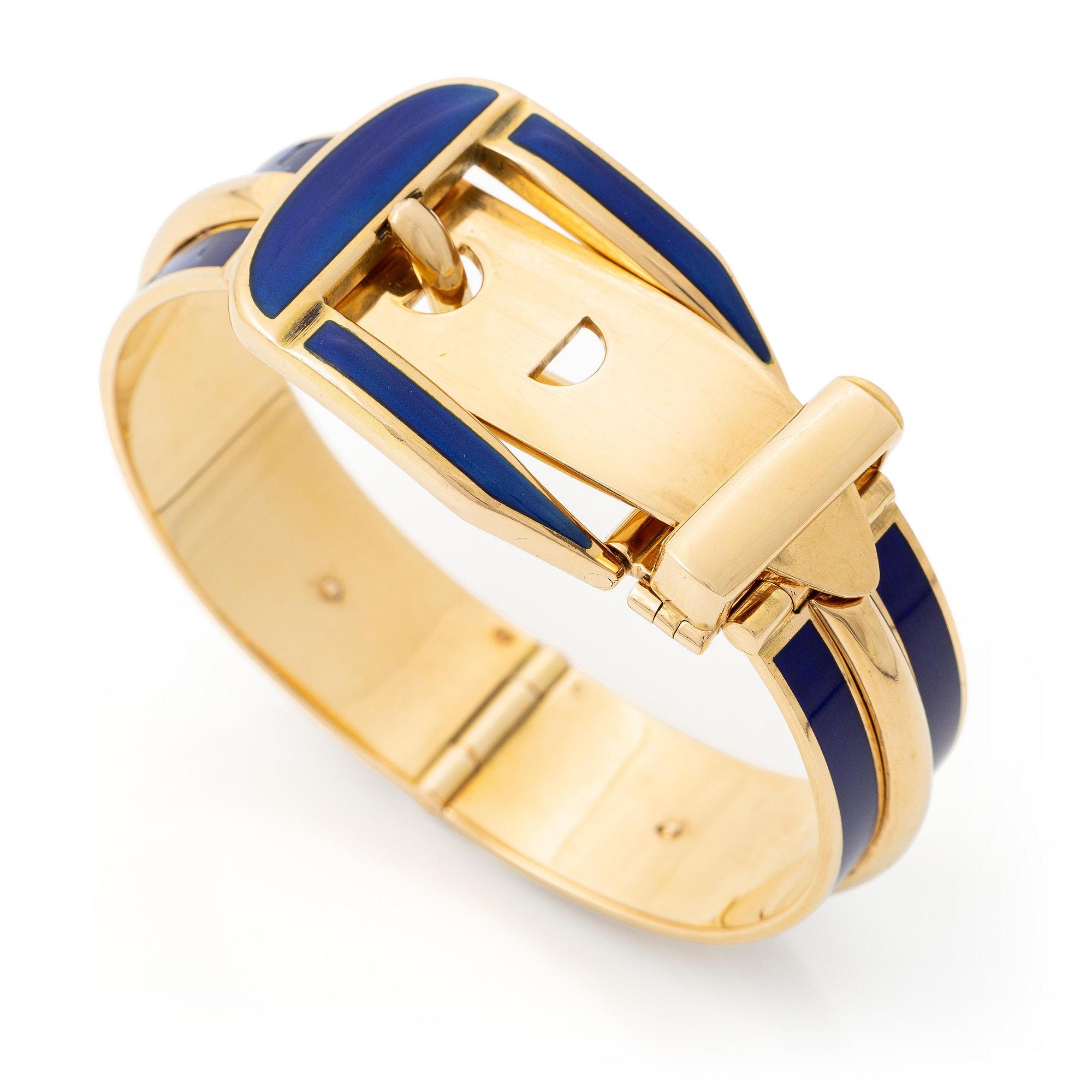 A Gucci bracelet 18K gold with blue enamel.