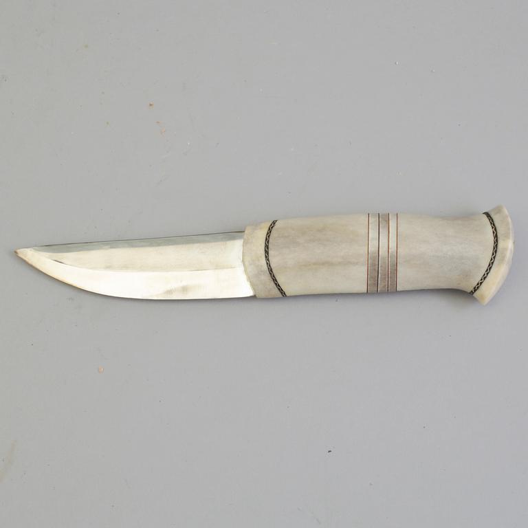 ISAK-MATTI JUUSO, a Sami reindeer horn knife, signed Isak-M Juuso and dated -07.