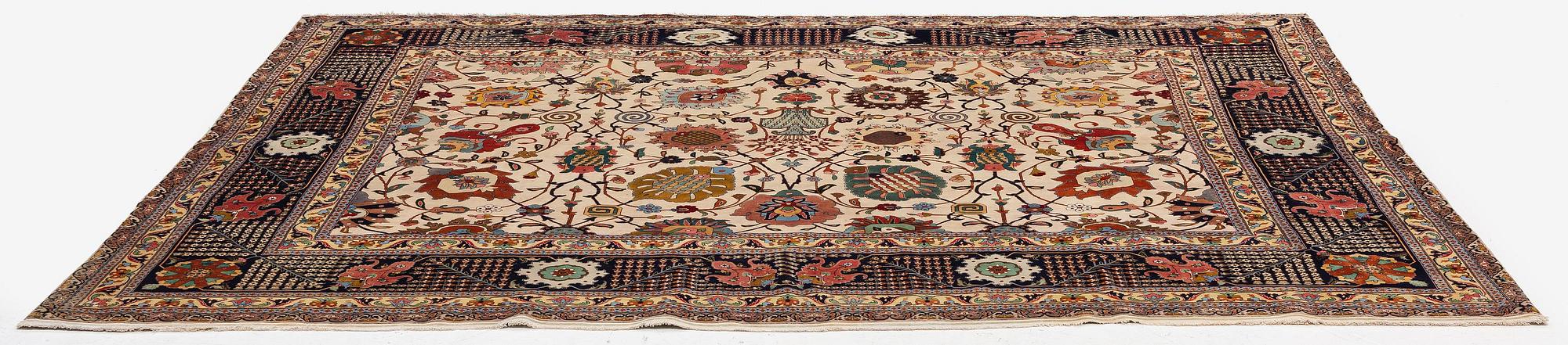 A semi-antique Tabriz carpet, Northwest Persia, of Safavid 'Vase' design, c.328 x 242 cm.