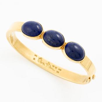 Wiwen Nilsson, a bracelet, 18K gold with lapis lazuli, Lund 1965.