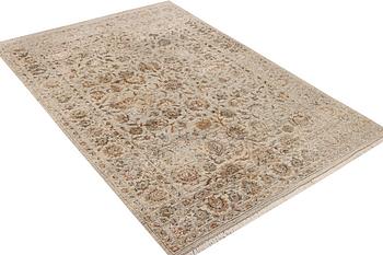 An Ushak Design, silk rug, a. 242 x 170 cm.