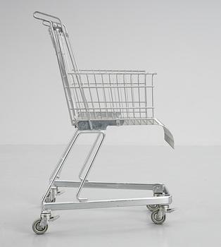 A Frank Schriener 'Consumer's Rest'  galvanized steel wire shopping cart chair, model 2, Stiletto Studios,