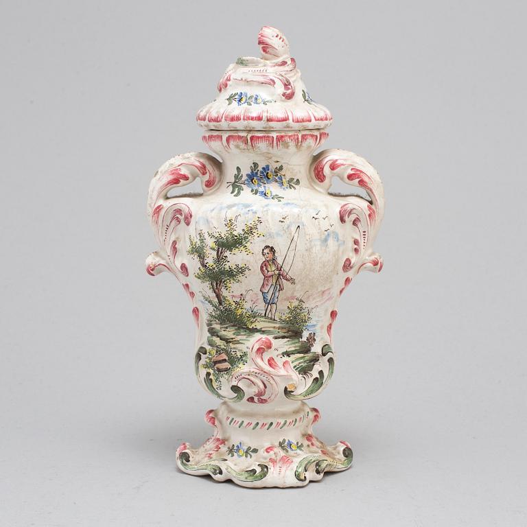 A Rococo faiance vase with cover, mid 18th century.