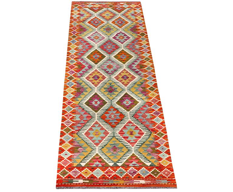 A Kilim runner carpet, c. 291 x 80 cm.