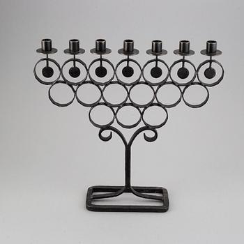 A cast iron candelabra by Bertil Vallien for Kosta Smide, Sweden.