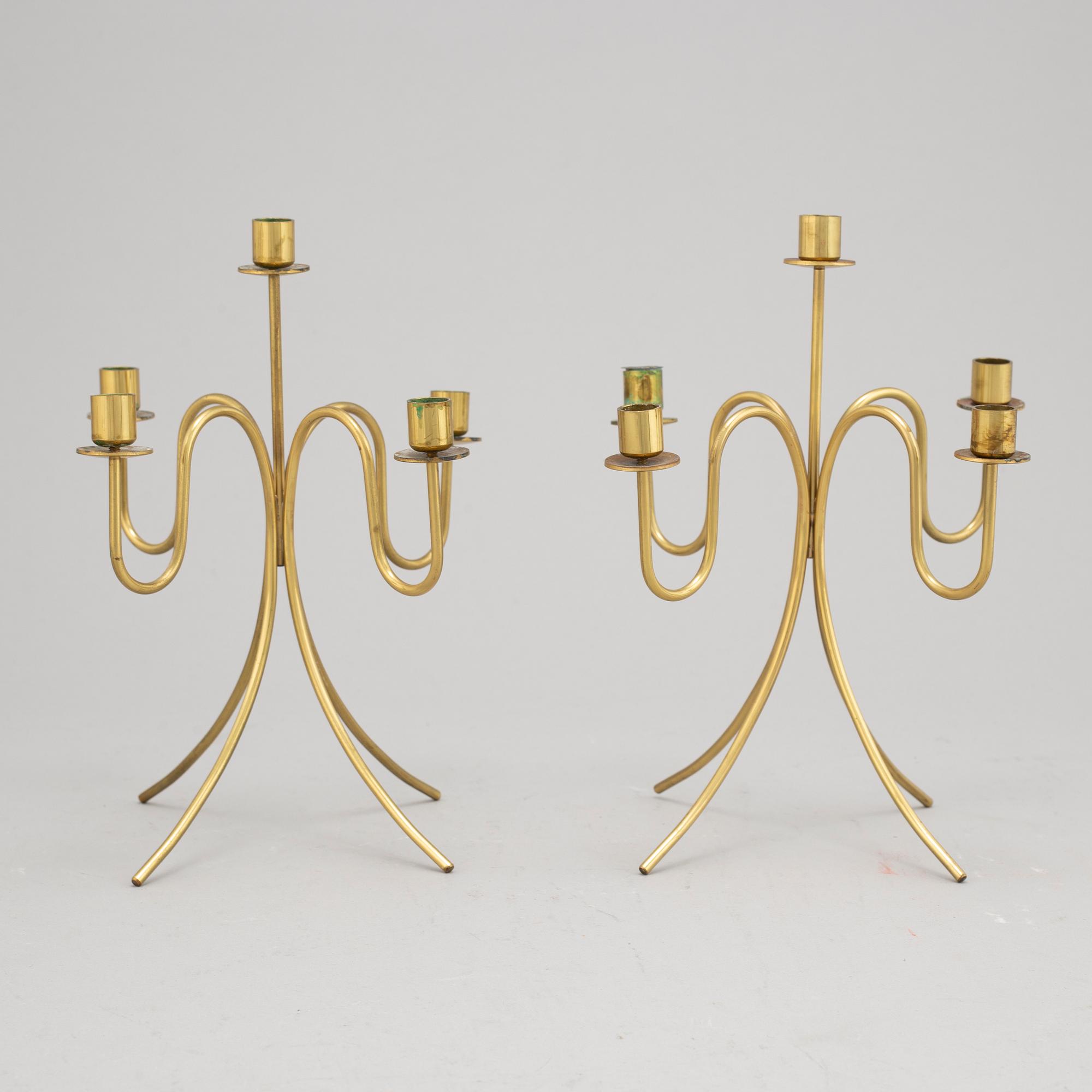 Gunnar Ander, a pair of five-light brass candelabra from Ystad Metall.