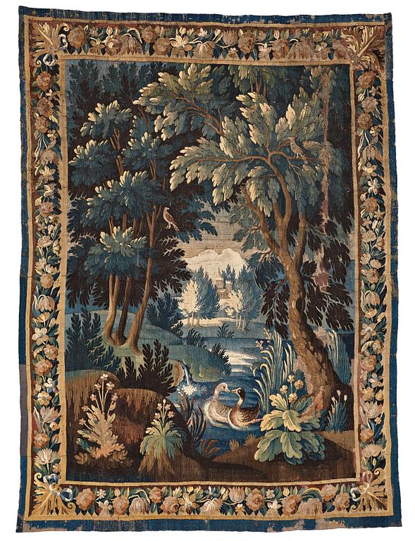 A TAPESTRY, tapestry weave, a "Verdure",  ca 304 x 224,5 cm, Flanders 17th century, signed "W" a lily "B".