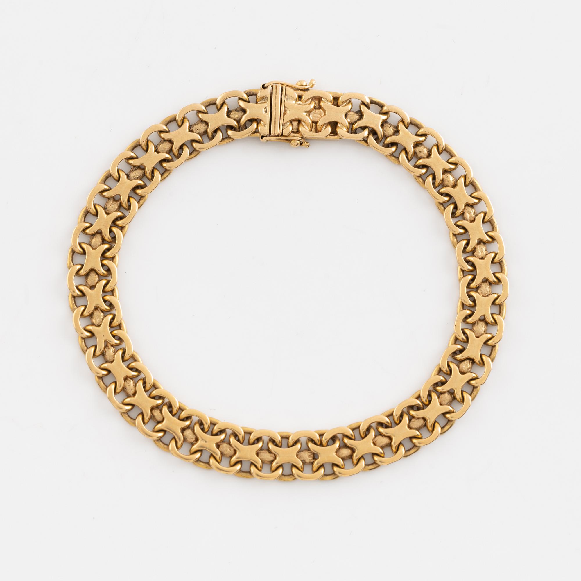 Armlänk, "x-länk", 18K guld. Bolidenguld.