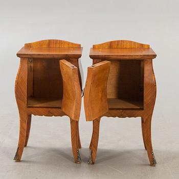 A pair of Baroque style mahogany bedside tables first half of the 20th century.