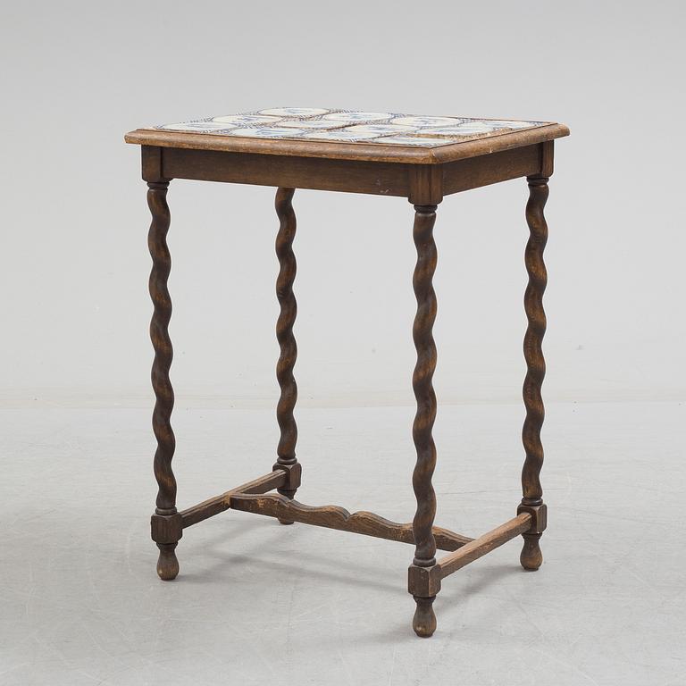 A 20th century Baroque-style table with tiles.